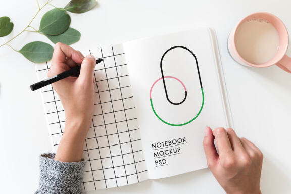 Hands Holding Notebook Mockup
