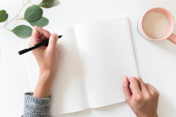 Hands Holding Notebook Mockup