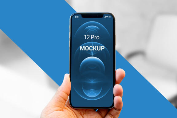 Holding iPhone 12 Pro in Hand - Free Mockup