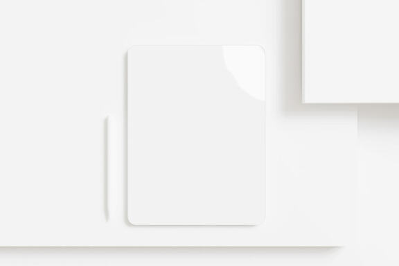 Tablet mockup with stylus on the side looks top view in minimalist white background