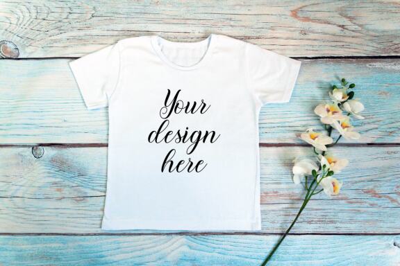 Kids White t-shirt Mockup bundle on a wooden background.