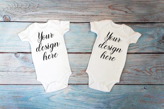 Kids Mockup Bundle of two baby bodysuits with toys. Twin baby bodysuit mockup. Kids Mockup Bundle.