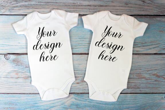 Kids Mockup Bundle of two baby bodysuits with toys. Twin baby bodysuit mockup. Kids Mockup Bundle.
