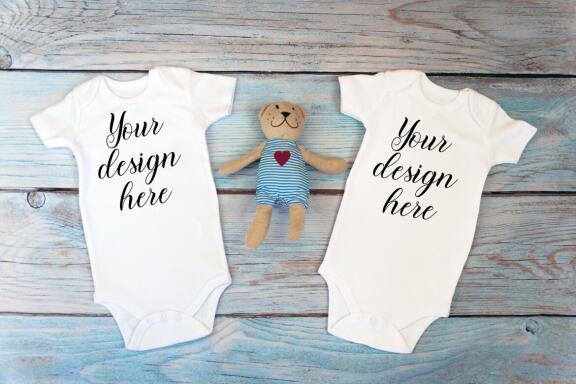 Kids Mockup Bundle of two baby bodysuits with toys. Twin baby bodysuit mockup. Kids Mockup Bundle.