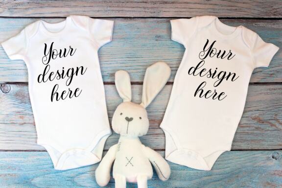 Kids Mockup Bundle of two baby bodysuits with toys. Twin baby bodysuit mockup. Kids Mockup Bundle.
