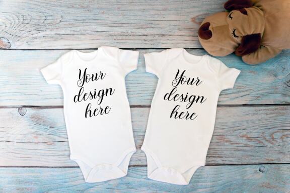 Kids Mockup Bundle of two baby bodysuits with toys. Twin baby bodysuit mockup. Kids Mockup Bundle.