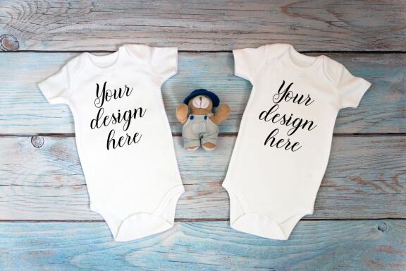 Kids Mockup Bundle of two baby bodysuits with toys. Twin baby bodysuit mockup. Kids Mockup Bundle.
