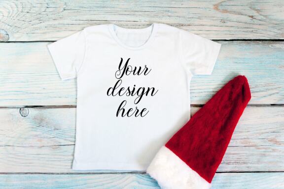 Christmas t-shirts and bodysuits mockups Bundle on a wooden background. Winter Christmas styled photo mockup.