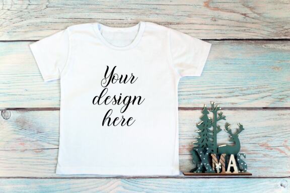 Christmas t-shirts and bodysuits mockups Bundle on a wooden background. Winter Christmas styled photo mockup.