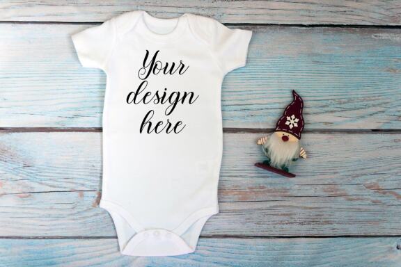 Christmas t-shirts and bodysuits mockups Bundle on a wooden background. Winter Christmas styled photo mockup.