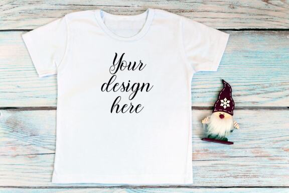 Christmas t-shirts and bodysuits mockups Bundle on a wooden background. Winter Christmas styled photo mockup.