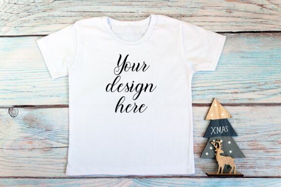 Christmas t-shirts and bodysuits mockups Bundle on a wooden background. Winter Christmas styled photo mockup.
