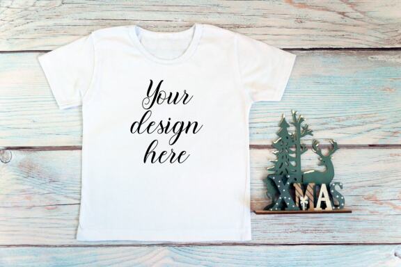Christmas t-shirts and bodysuits mockups Bundle on a wooden background. Winter Christmas styled photo mockup.