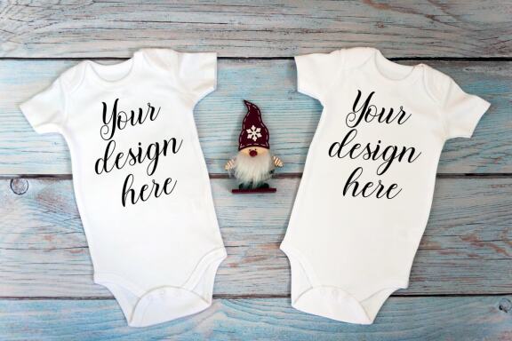 Christmas t-shirts and bodysuits mockups Bundle on a wooden background. Winter Christmas styled photo mockup.