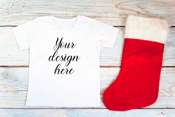 Christmas t-shirts and bodysuits mockups Bundle on a wooden background. Winter Christmas styled photo mockup.