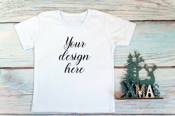 Christmas t-shirts and bodysuits mockups Bundle on a wooden background. Winter Christmas styled photo mockup.
