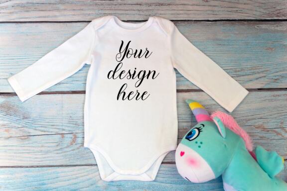 Bodysuit Mockup Bundle with long sleeves on a wooden background.