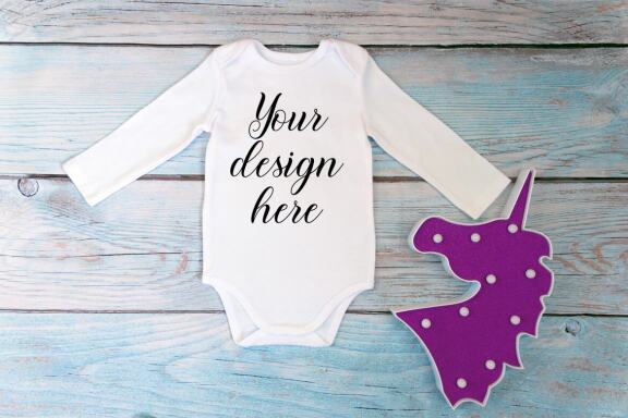 Bodysuit Mockup Bundle with long sleeves on a wooden background.