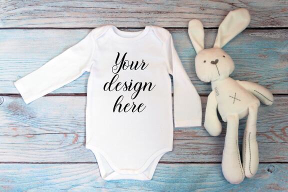 Bodysuit Mockup Bundle with long sleeves on a wooden background.