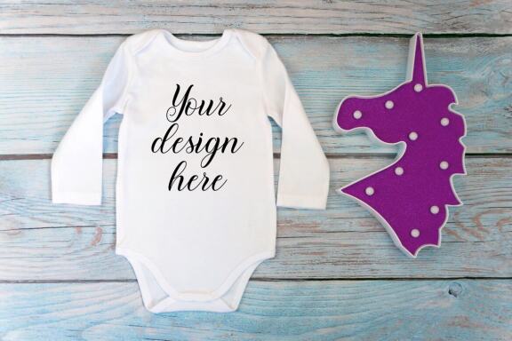 Bodysuit Mockup Bundle with long sleeves on a wooden background.