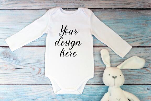 Bodysuit Mockup Bundle with long sleeves on a wooden background.
