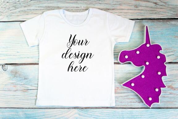 White kid t-shirt mockup bundle. T-shirt on a wooden background.