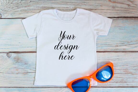 White kid t-shirt mockup bundle. T-shirt on a wooden background.
