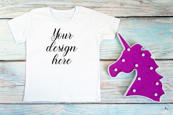 White kid t-shirt mockup bundle. T-shirt on a wooden background.