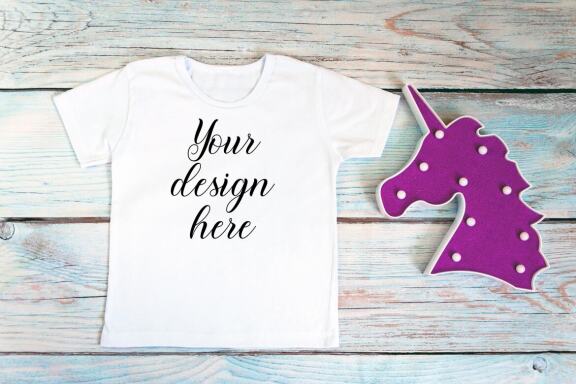 White kid t-shirt mockup bundle. T-shirt on a wooden background.