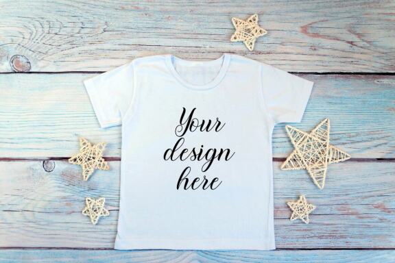 White kid t-shirt mockup bundle. T-shirt on a wooden background.
