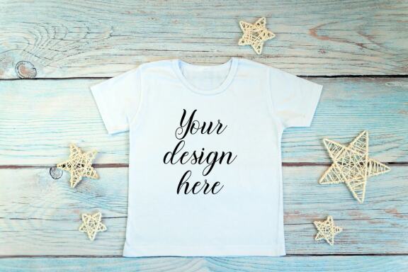 White kid t-shirt mockup bundle. T-shirt on a wooden background.