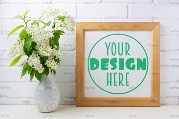Square wooden picture frame mockup with bird cherry bouquet.