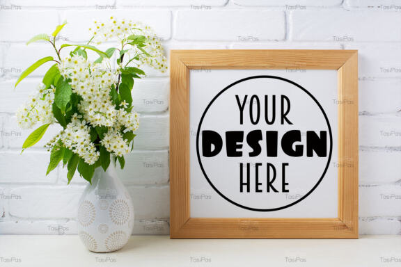 Square wooden picture frame mockup with bird cherry bouquet.