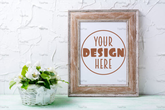Wooden picture frame mockup with apple tree flowers.