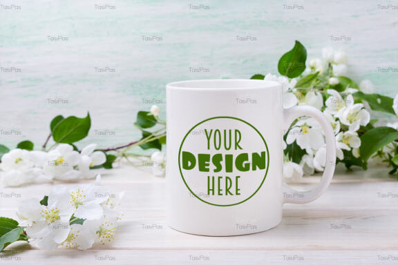 White coffee mug mockup with tender apple blossom.