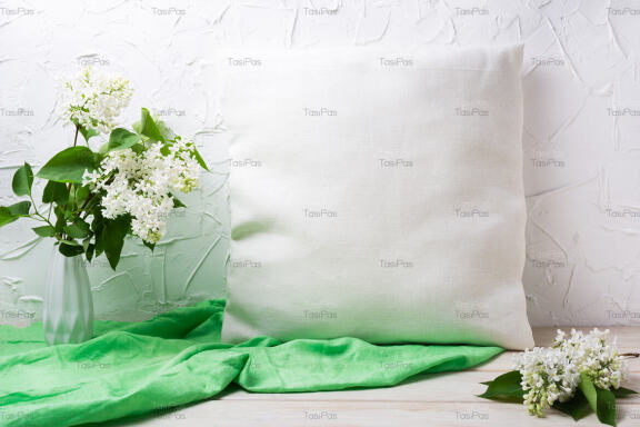 Pillow mockup with white lilac in the vase.