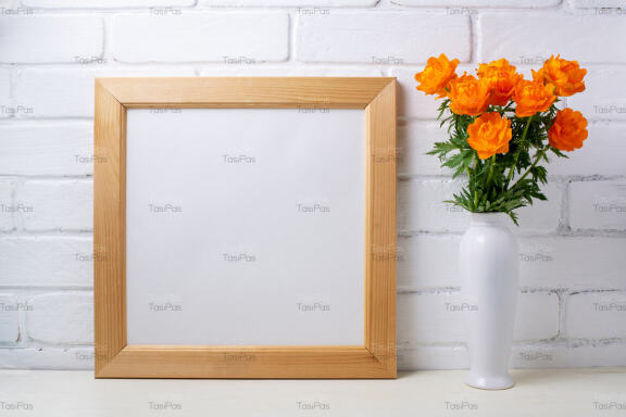 Square wooden picture frame mockup with orange wild globeflowers.