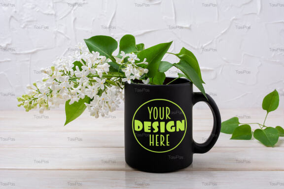 Black coffee mug mockup with blooming white lilac.