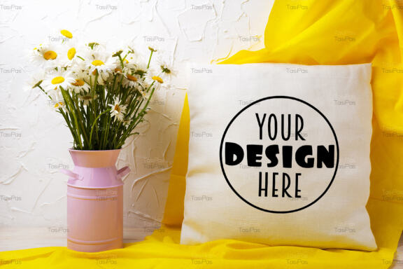 Pillow mockup with daisy flowers and yellow scarf.