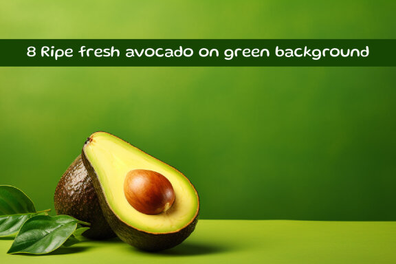 Ripe fresh avocado on green background
